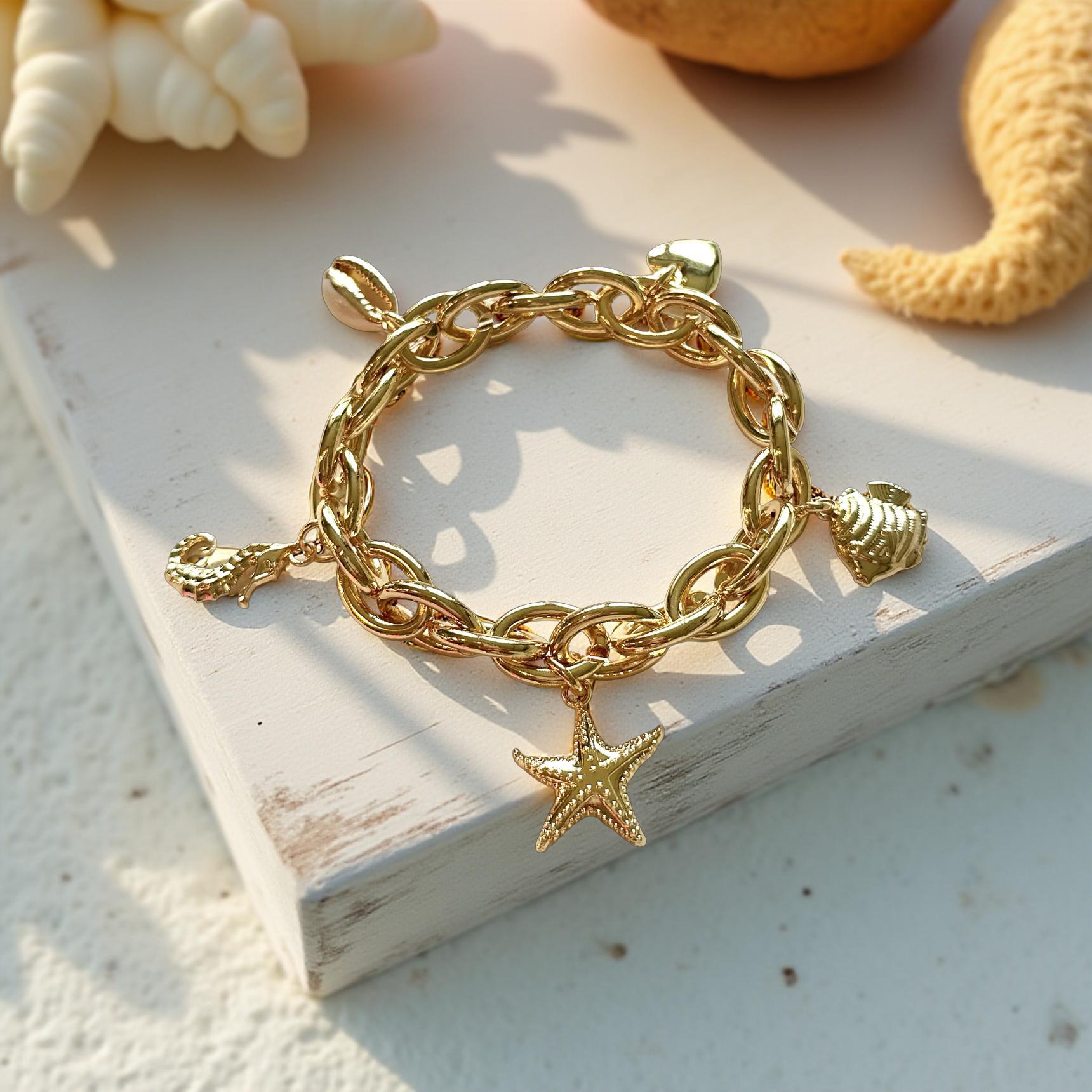 Goldenes Armband | elastisches Gliederketten Armband mit Charms wie Seestern, Seepferdchen, Herz, Fisch und Muschel